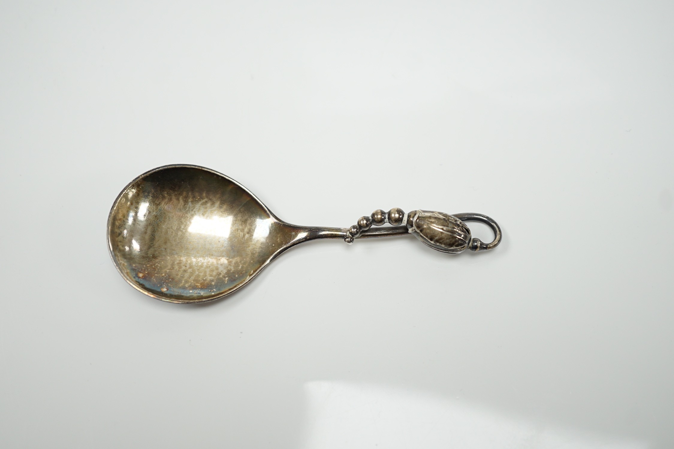 A George VI Georg Jensen silver blossom pattern caddy spoon, import marks for 1948, no.84, 10.2cm.